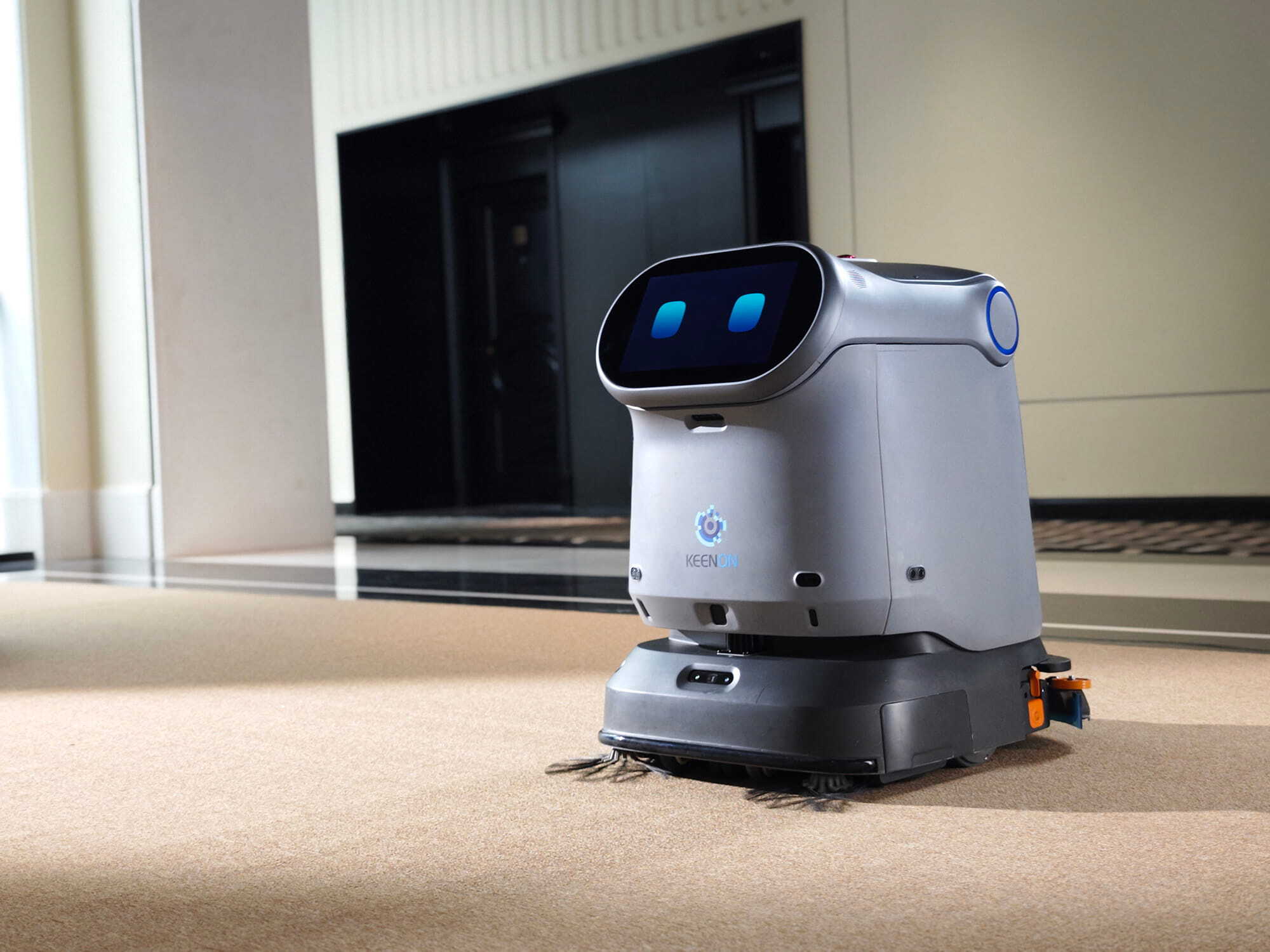 Keenon KLEENBOT C40 cleaning robot in a hotel corridor